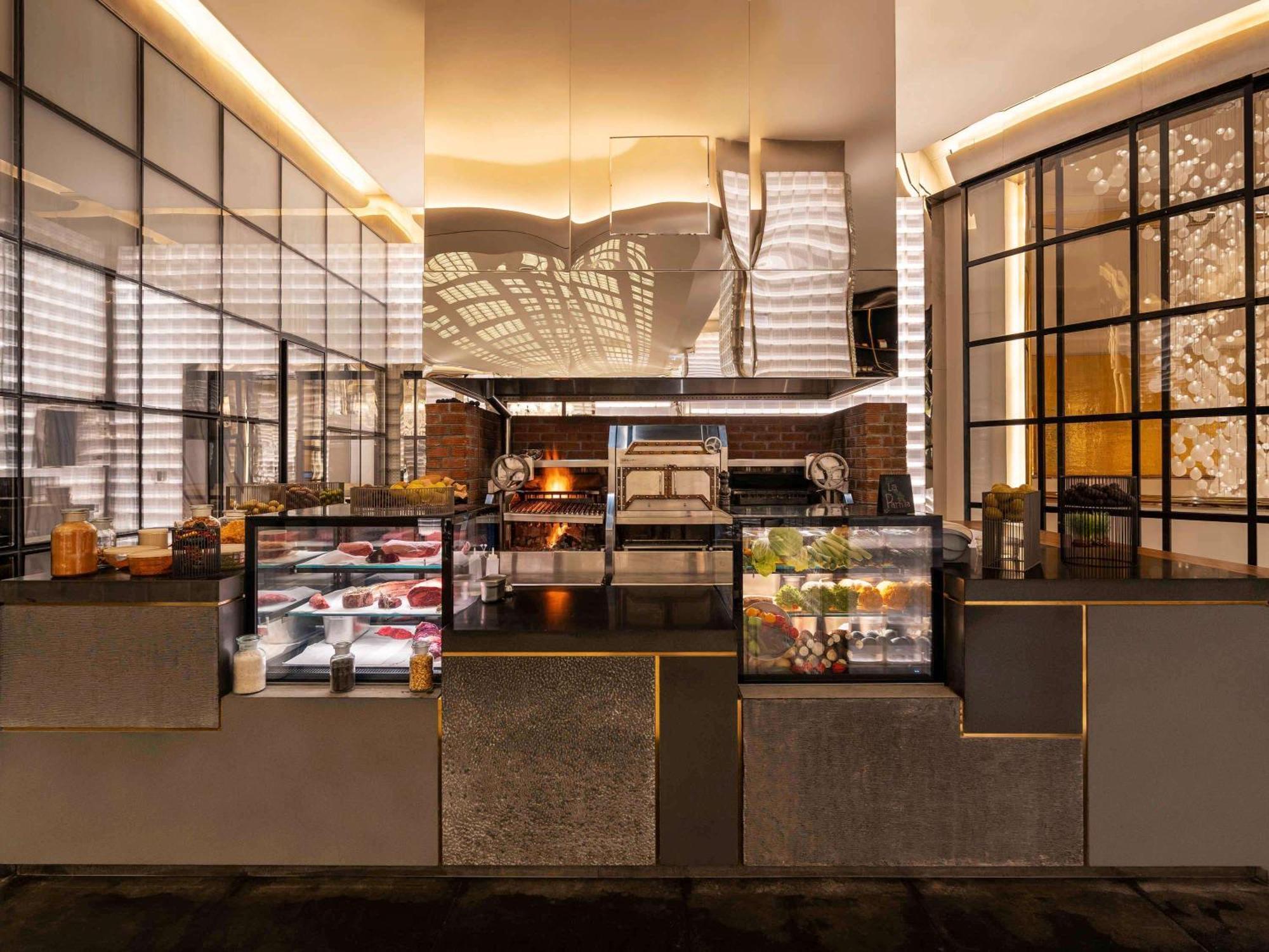 Fairmont Doha Hotel Lusail Exterior photo The kitchen at the restaurant